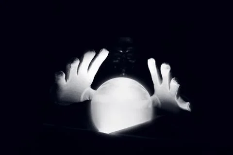 Spiritual session predicting the future. Open hands in white gloves over a Stock Photos