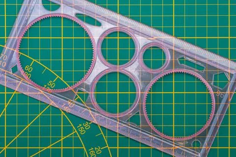 Spirograph drawing template with a ruler on a cutting mat Stock Photos