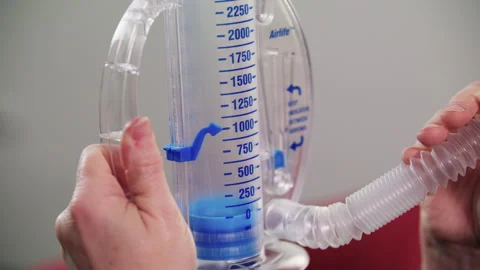 Spirometer Woman Blows Into It Vidéo 164053769