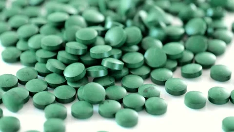 Spirulina algae green tablets. Slow rotation. Stock Footage 276258554