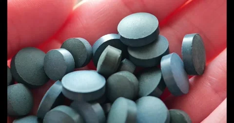 Spirulina pills close-up.Natural source of iodine.Super food . Video stock 273845008