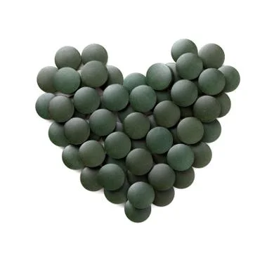 Spirulina tablets isolation Stock Photos