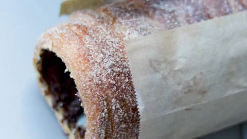 Spit cake covered with sugar and cinnamon with nutella pasta inside. 動画素材 167905650
