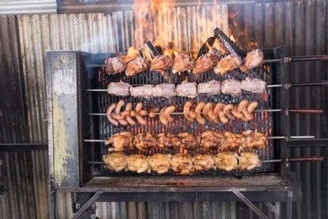Spit-roast chickens Stock Photos