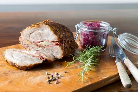 Spit roast with red cabbage Stock Photos