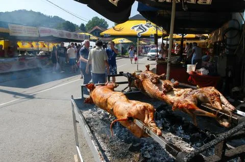 Spit roasted pork and lamb barbecue at Guca Trumpet Festival Stock Photos