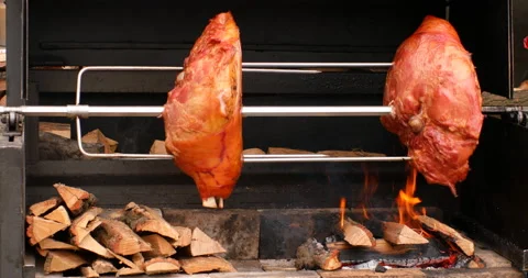 Spit roasting pork legs Stock-Footage 97764533