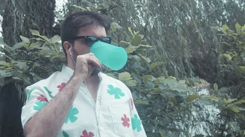 Spit take outside funny Stock Footage 157695792