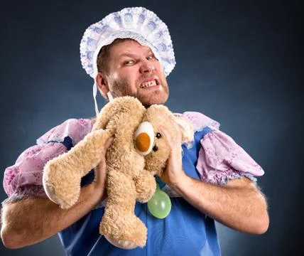 Spiteful man with teddy bear Stock Photos