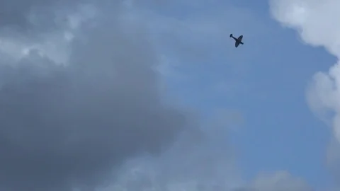Spitfire in dark sky flying past 4K Stock-Footage 82473521
