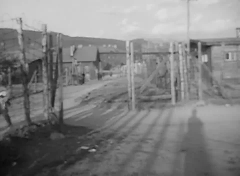 SPITTAL AN DER DRAU, AUSTRIA - 1945: Secured entrance - Open gate frames track Stock Footage 344903016