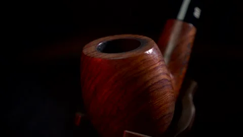 Spitting tobacco pipe Stock Footage 143990191