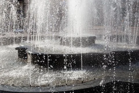 Splash and drops in a spring fontain. 스톡 사진