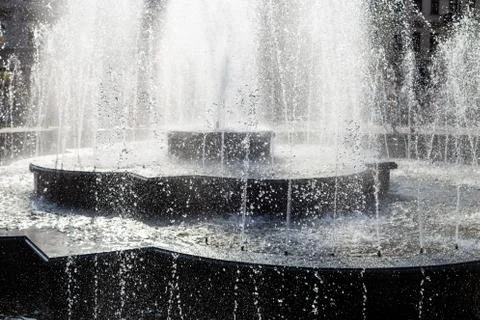 Splash and drops in a spring fontain. 스톡 사진