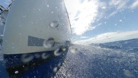 Splash on the bow of a catamaran sailboat in speed - Close-up shot Slow Motion Stock Footage 133464766