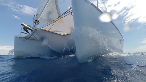 Splash on the bow of a catamaran sailboat in speed - Close-up shot Slow Motion Stock Footage 133464794
