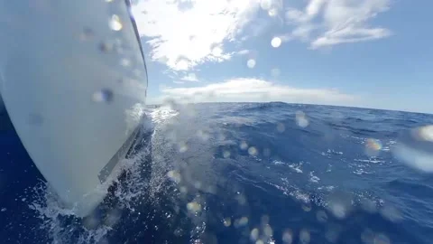 Splash on the bow of the sailboat - Close-up shot over the sea surface Stock Footage 133464603