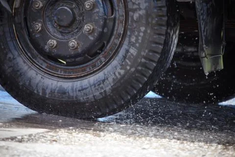 Splash by a car as it goes through flood water Stock Photos