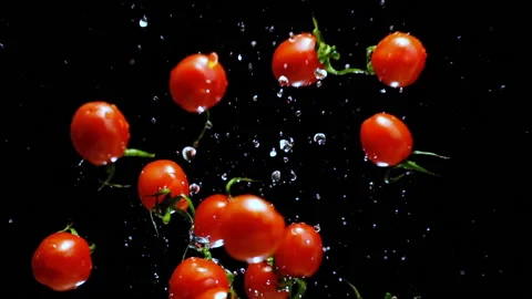 Splash up cherry tomatoes 1 Stock Footage 169225123