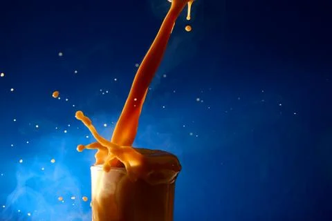 Splash of coffee latte Stock Photos