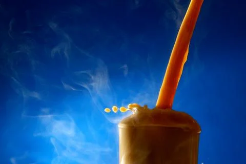Splash of coffee latte Stock Photos