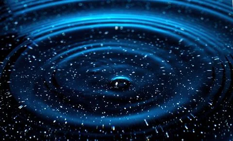 Splash - a drop falling onto the water surface in a color macro shot Stock Photos