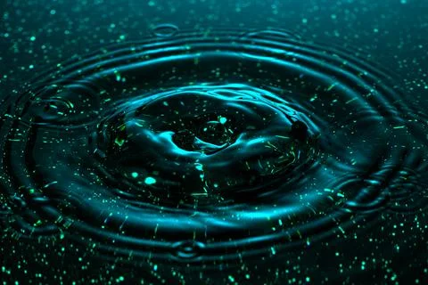 Splash - a drop falling onto the water surface in a color macro shot 스톡 사진