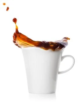 Splash with drops in a cup with coffee Stock Photos