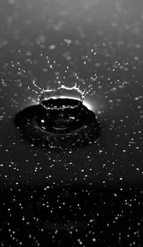 Splash - a falling drop of water in a macro photography shot Stock Photos