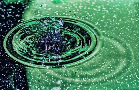 Splash - a falling drop of water in a macro photography shot Stock Photos