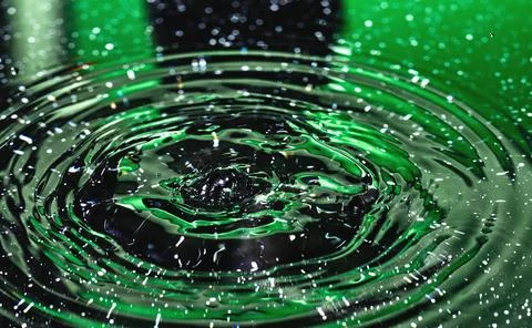 Splash - a falling drop of water in a macro photography shot Stock Photos