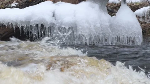 Splash formed Ice Over Rippling water in Montreal River Hurley Wisconsin Stock Footage 232362502