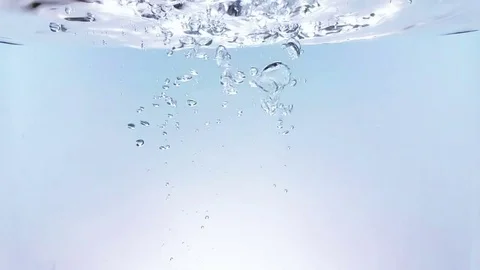 Splash fresh bubbles falling down into water, shot in slow motion on white Stock Footage 76241977