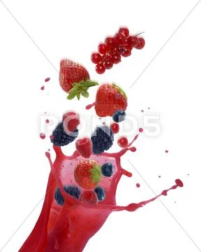 A splash of fruits of the forest juice with whole fruits Stock Photos
