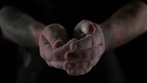 Splash hands with flour black background Video stock 69918654