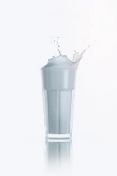 Splash of milk in glass Stock Photos