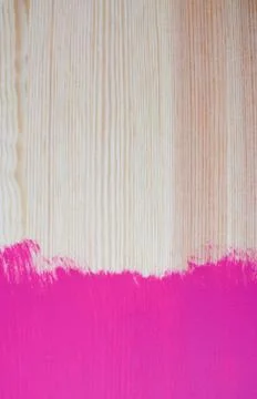 Splash of painted colour on pine plank Stock Photos