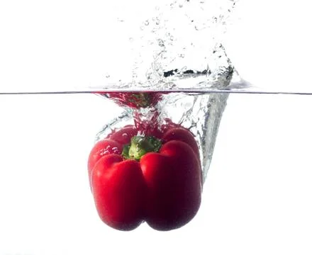 Splash peppers Stock Photos