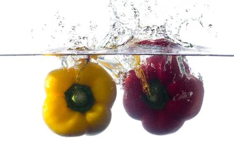 Splash peppers Stock Photos