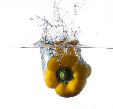Splash peppers Stock Photos