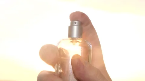 Splash of perfume on the background of the sunset. Perfume advertisement Stock Footage 233783630