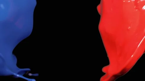 Splash of red and blue paint liquid in slow motion isolated on black (4K) Stock Footage 137111303