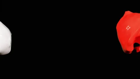 Splash of red and white paint liquid in slow motion isolated on black (4K) Stock Footage 137111956