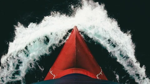 Splash of a sea wave against cargo ship's bow Stock Footage 98625196