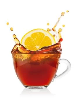 Splash from slice of lemon in cup of tea Stock Photos