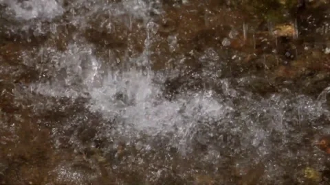 The splash of a small and natural waterfall Video stock 297805869