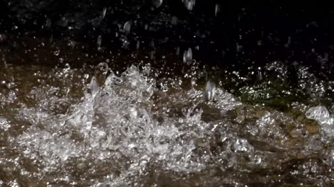 The splash of a small and natural waterfall 動画素材 297806063