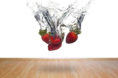 Splash strawberries into interior / abstract Stock Photos