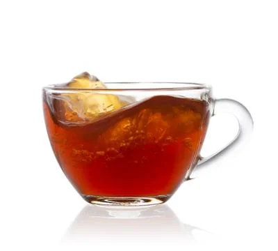 Splash in transparent cup of tea Stock Photos