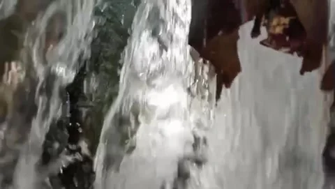 Splash view water forms foam small white below. Stockbeeldmateriaal 331242932